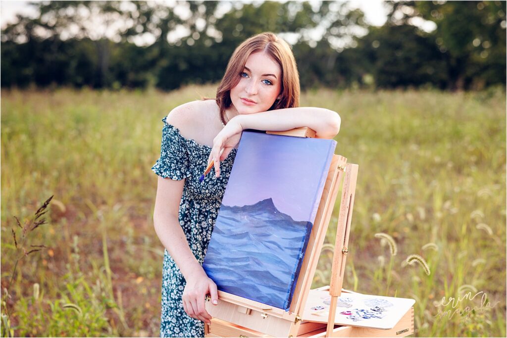 girl takes senior pictures with art easel in nashville tn